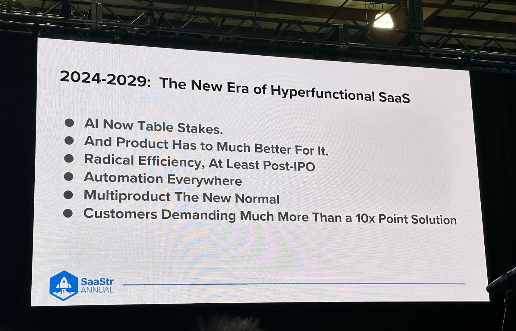 SaaStr Annual slide titled '2024-2029, the new era of hyperfunctional SaaS', listing AI as table stakes, radical efficiency, automation everywhere and multiproduct as the new normal