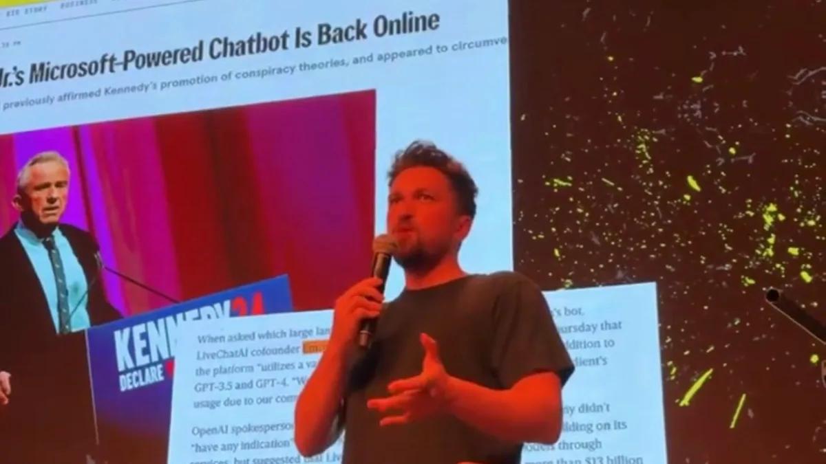 Emre Elbeyoglu speaking at Fuckup Nights Ankara in front of a slide of the WIRED article Robert F. Kennedy Jr.'s Microsoft-Powered Chatbot Is Back Online